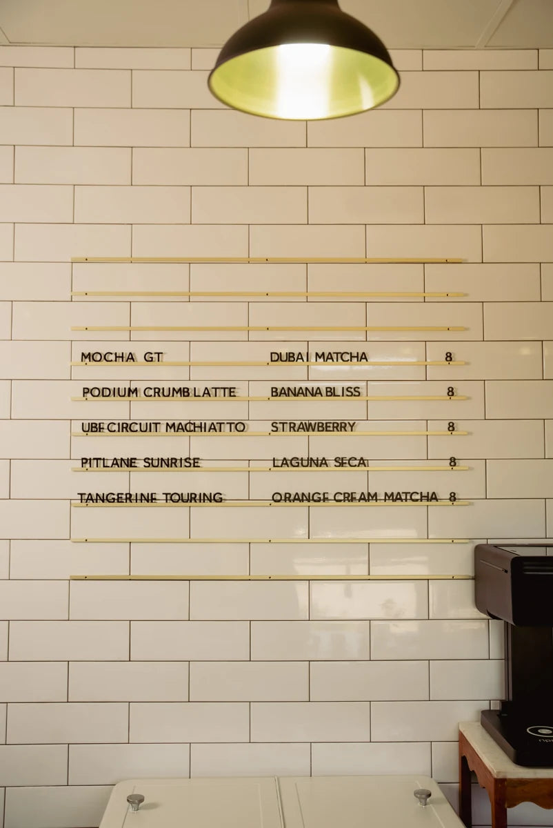 The cafe menu on the tiled wall